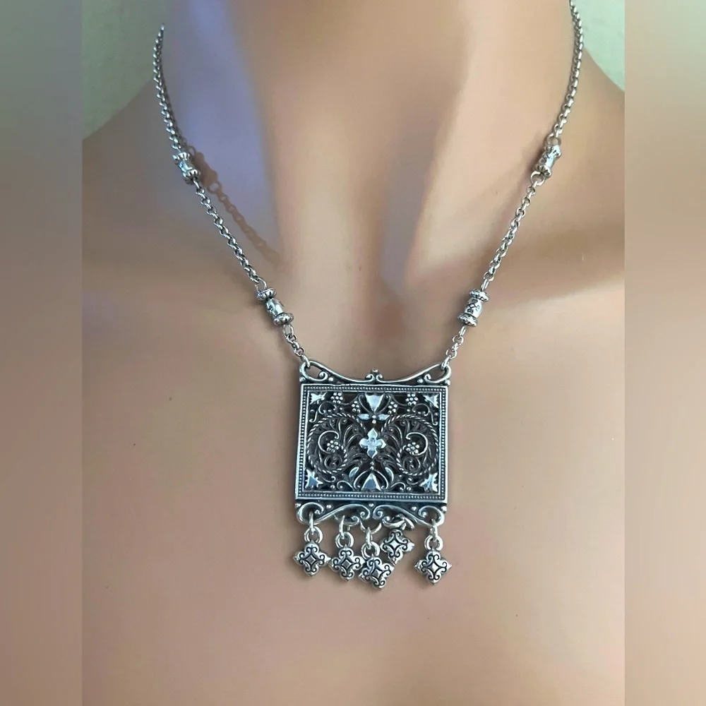 Brighton pendant necklace. Square pendant with loose charms. 10